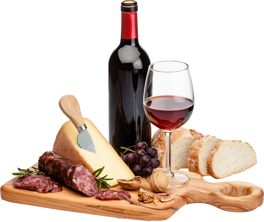 Wooden board with cheese, meats, grapes, bread, wine